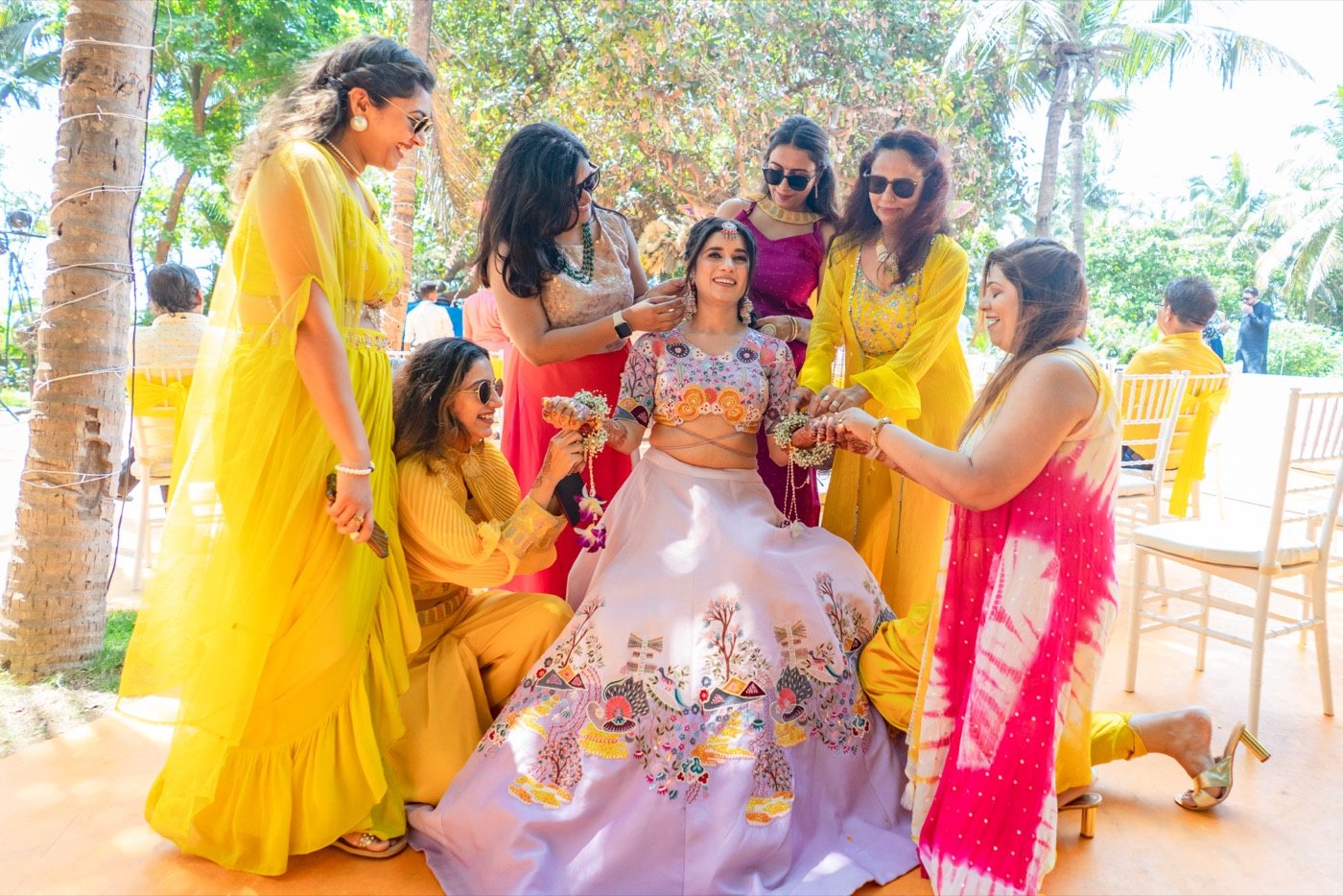 A bride in lilac surrounded by her bridesmaids