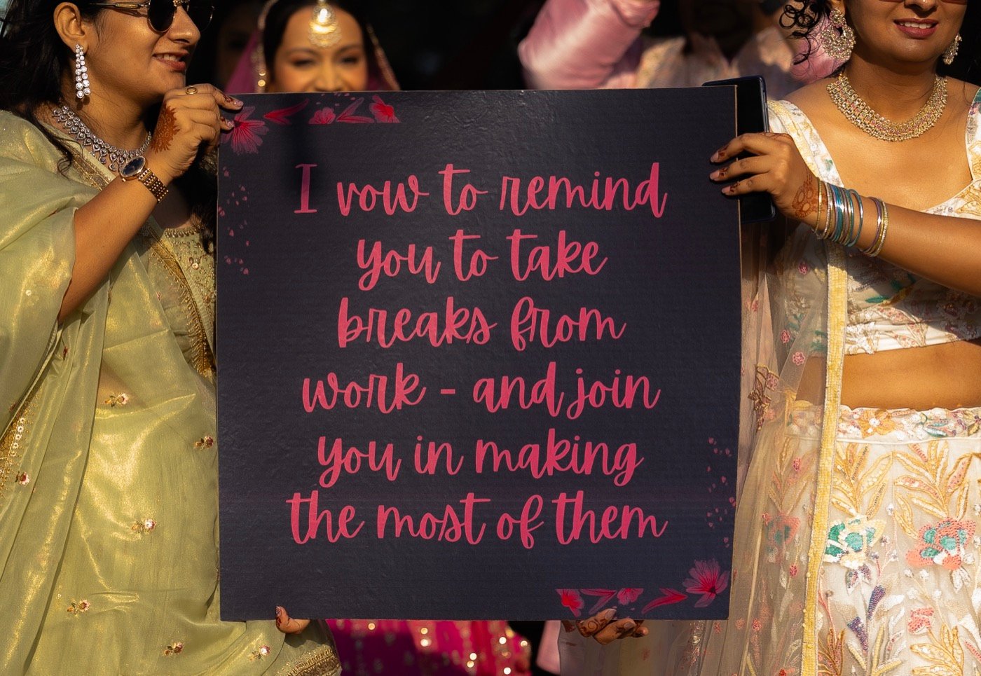 Bridesmaids holding up a handwritten wedding vow